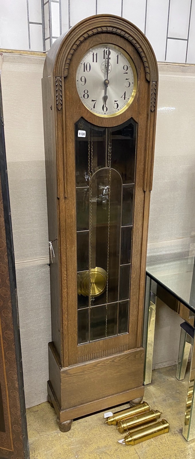 A 1920's oak cased 8 day longcase clock, height 192cm